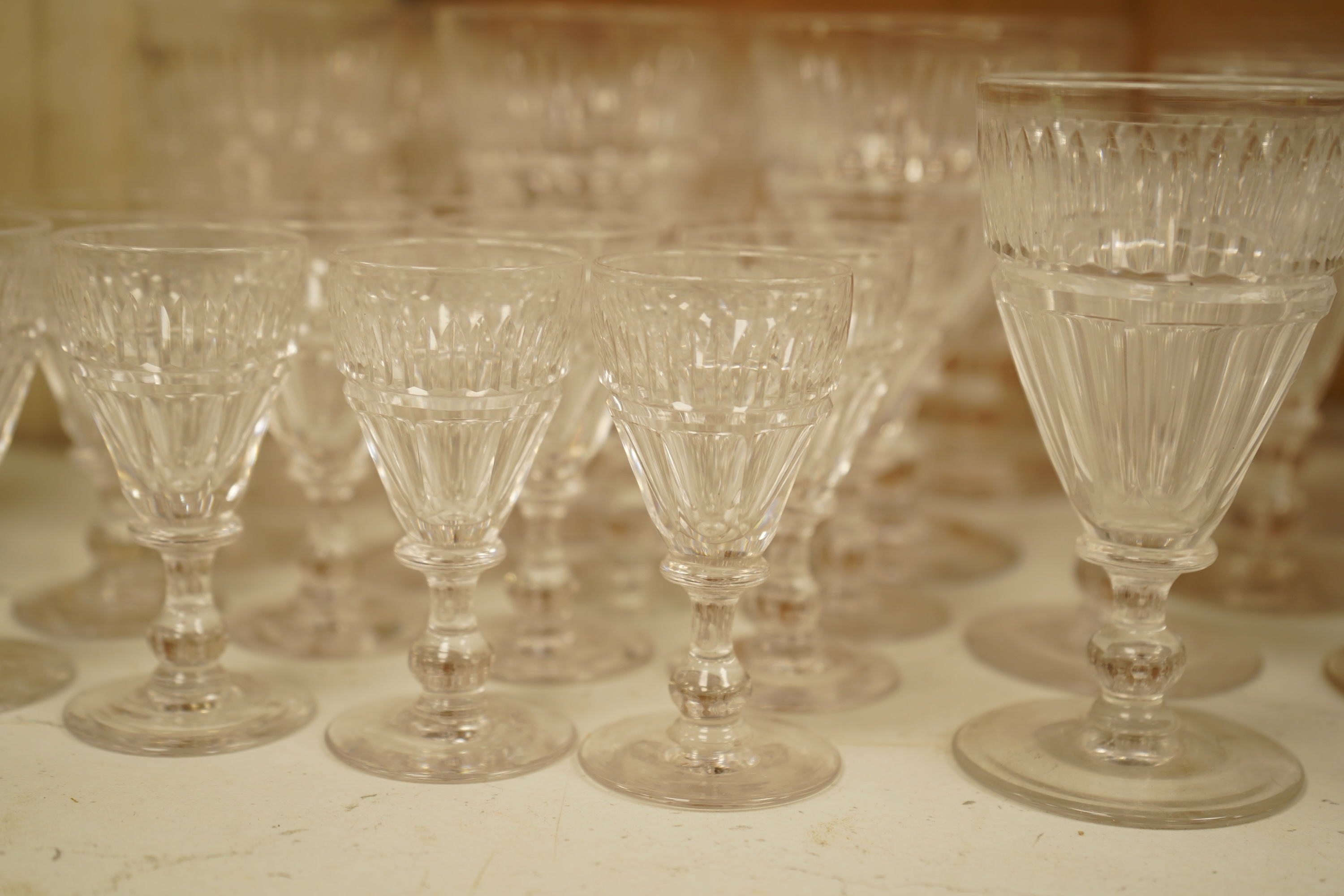 A part suite of 19th century cut glass drinking glasses, largest 13cm high